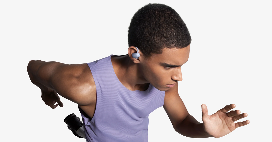 Runner wearing soundcore AeroFit 2 Pro open-ear earbuds during sprint training