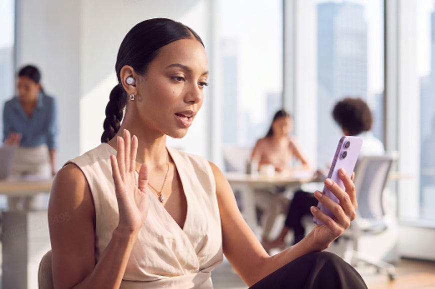 Anker soundcore Liberty Buds 2 worn by a woman on a video call in an office