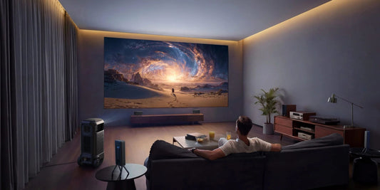 Nebula X1 Pro projector with surround speakers in a living room