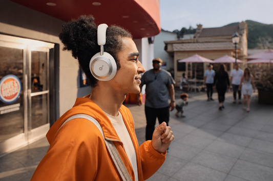 Traveler wearing soundcore headphones outdoors