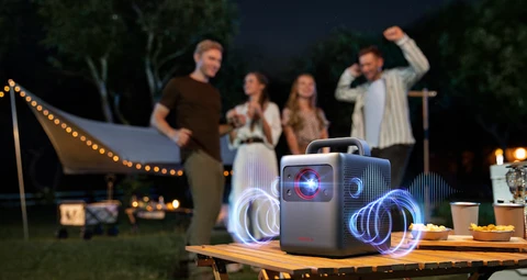 Nebula Cosmos 4K SE projector at an evening movie gathering