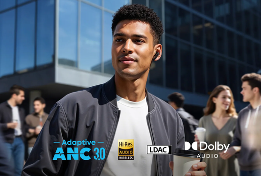 text: Man wearing black wireless earbuds listening to music