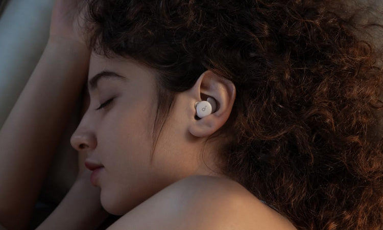 Side sleeper wearing soundcore Sleep A20