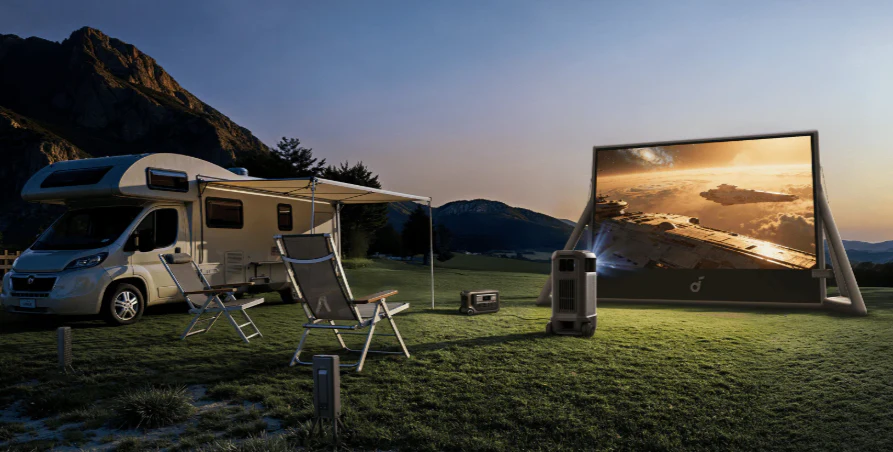 soundcore Nebula X1 Pro outdoor theater setup beside an RV for camping movie nights