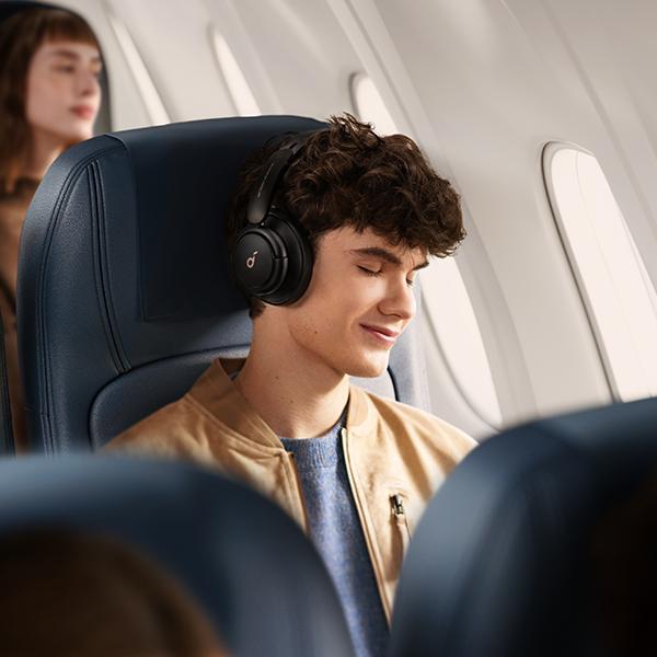 soundcore bluetooth headphones with noise cancelling worn on airplane