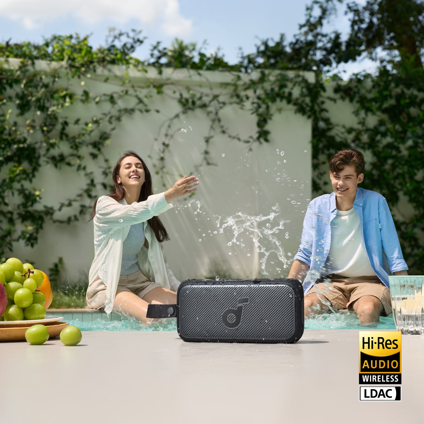 soundcore portable speaker with Hi-Res Audio by the pool.