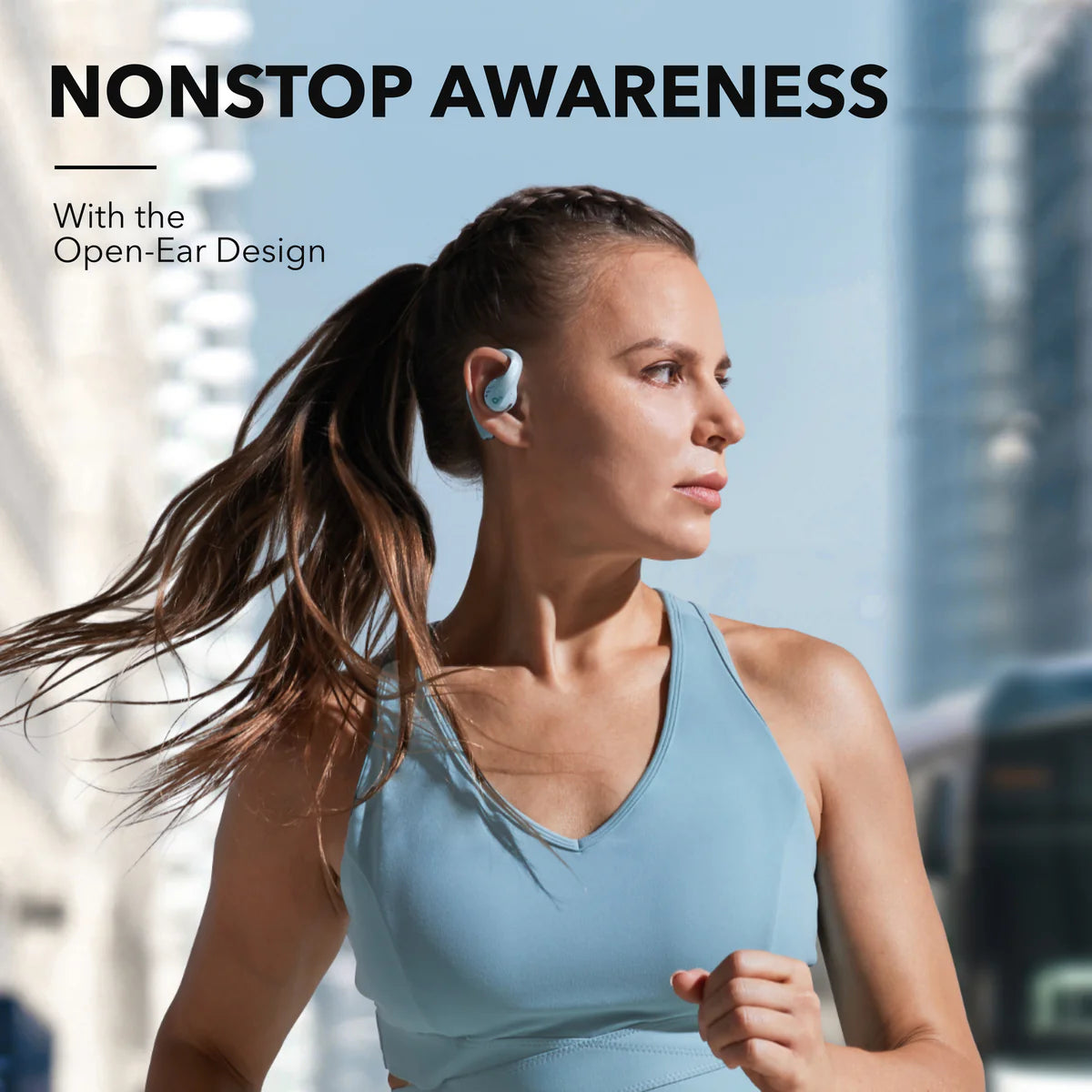 Woman running with soundcore open-ear earbuds for awareness