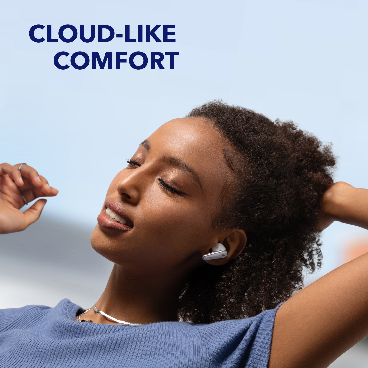 person relaxing with soundcore earbuds, cloud-like comfort