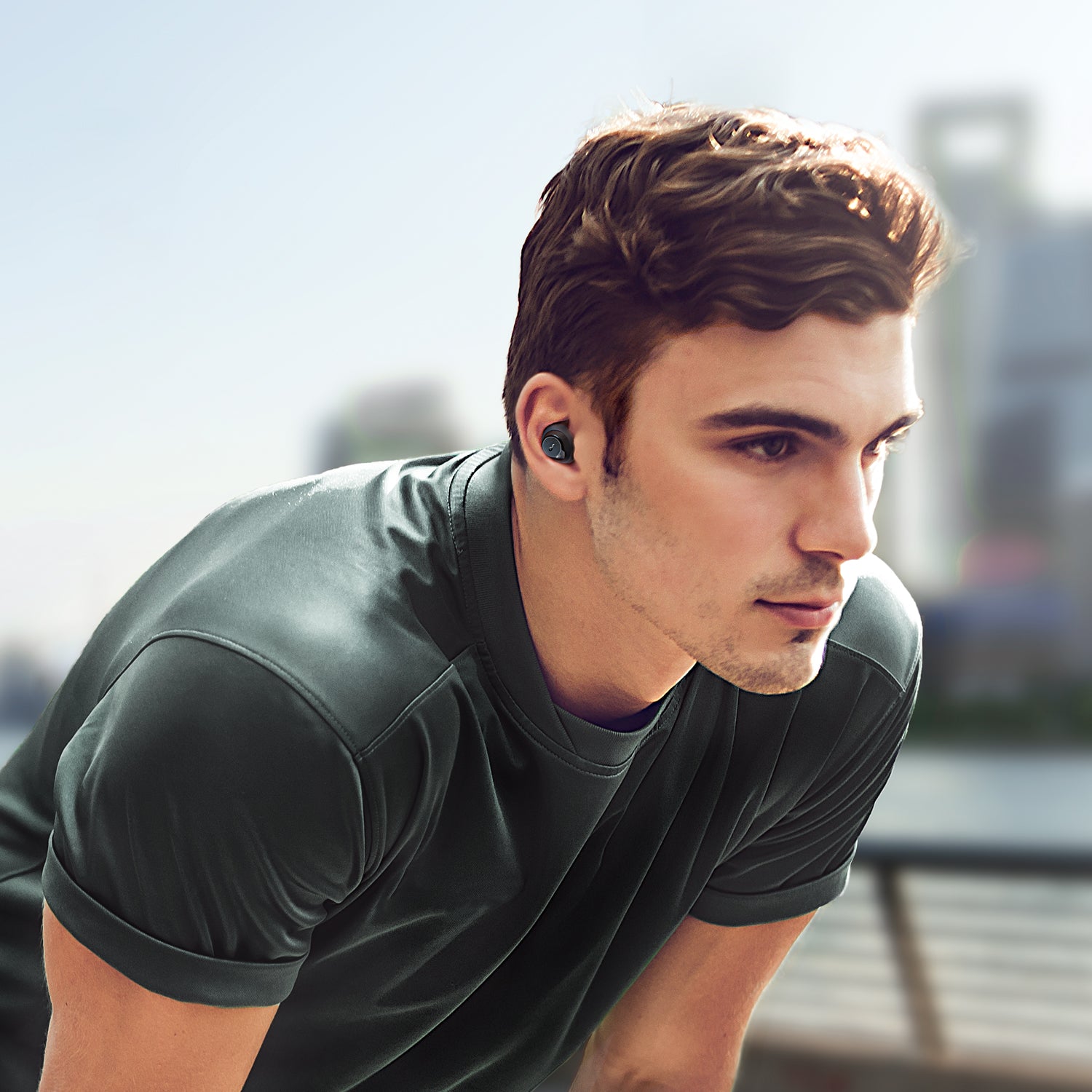 Man jogging with soundcore earbuds