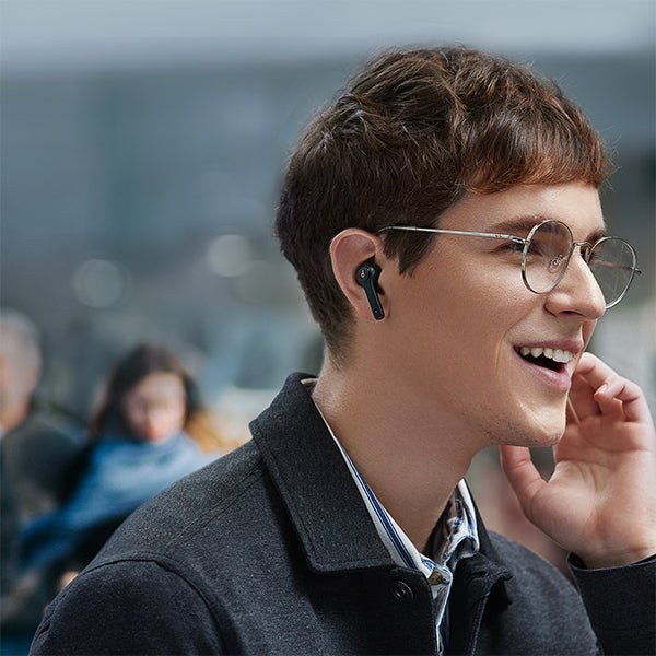 man wearing soundcore earbuds with stylish design