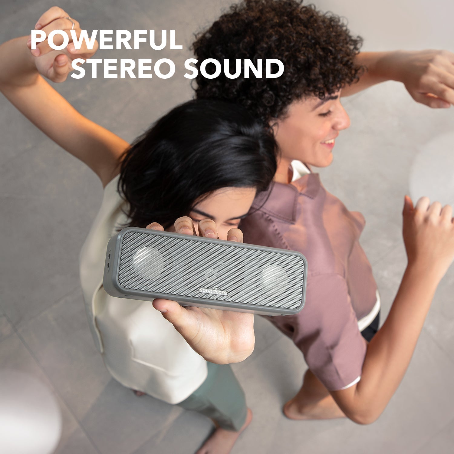 soundcore stereo speaker with people dancing